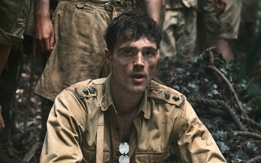 Jacob Elordi estrela a minissérie *The Narrow Road to the Deep North* no Prime Video, adaptada do romance de Richard Flanagan. A trama acompanha um cirurgião em um campo de prisioneiros na Segunda Guerra, enquanto revive um amor proibido. Estreia em 18 de abril. (50 palavras)
