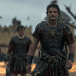 **Resumo:** O novo trailer de *Gladiador II*, dirigido por Ridley Scott, mostra Lucius (Paul Mescal), filho de Maximus, buscando vingança após ser capturado por um general (Pedro Pascal). O filme, com cenas épicas e revelações sobre o passado, estreia em 14/11/2024. (49 palavras)